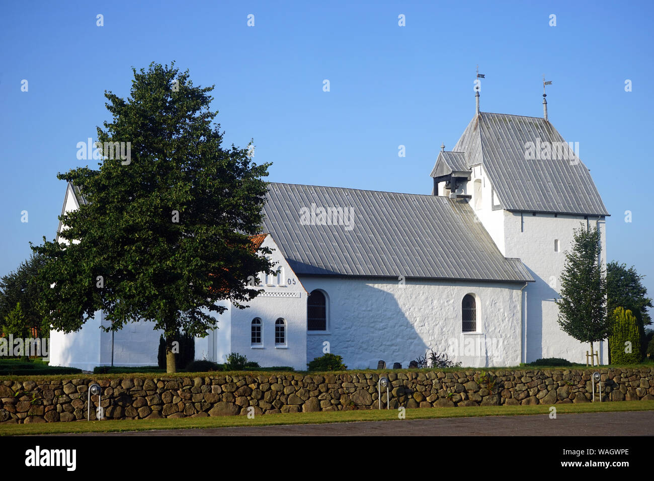 Traditional white church in Denmark Stock Photo