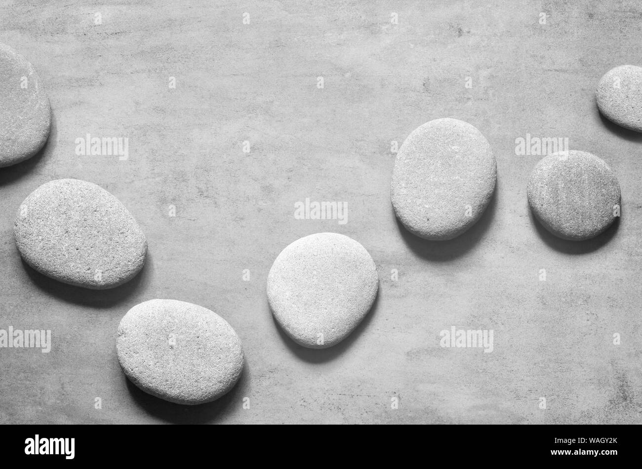 Flat lay composition with grey spa stones on grey background Stock ...