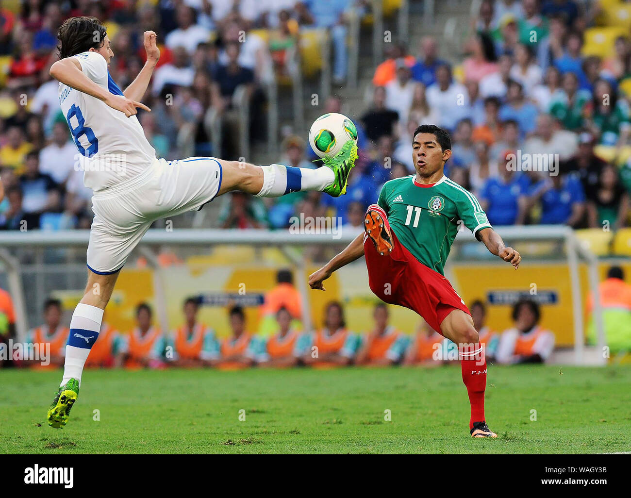 Rio de Janeiro, Brazil, June 16, 2013. Players playing the ball during the match Mexico vs Italy for the Confederations Cup at Maracana Stadium Stock Photo