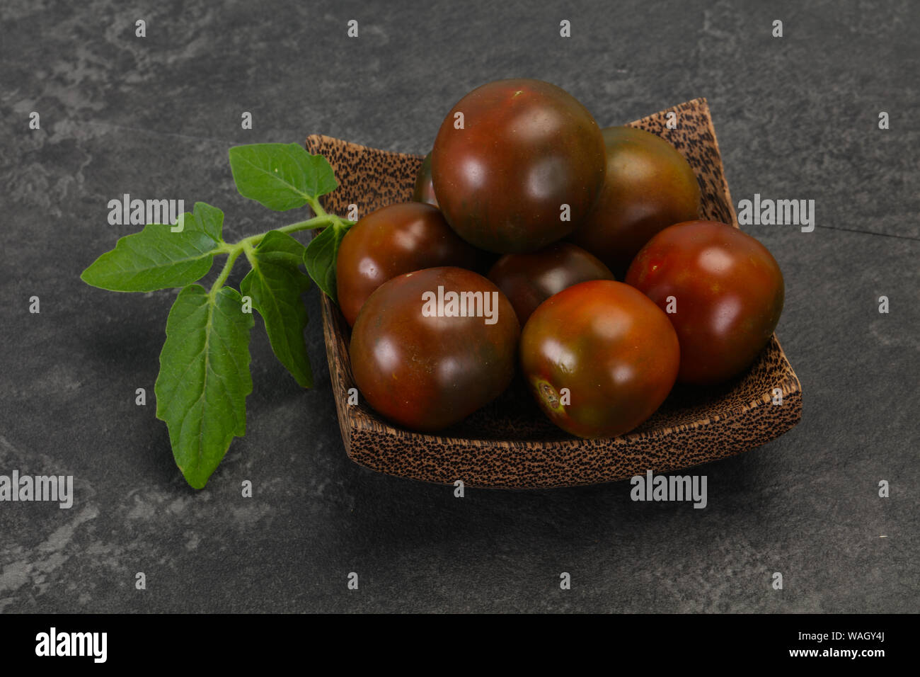 Black tomato tasty fresh ripe Kumato Stock Photo Alamy