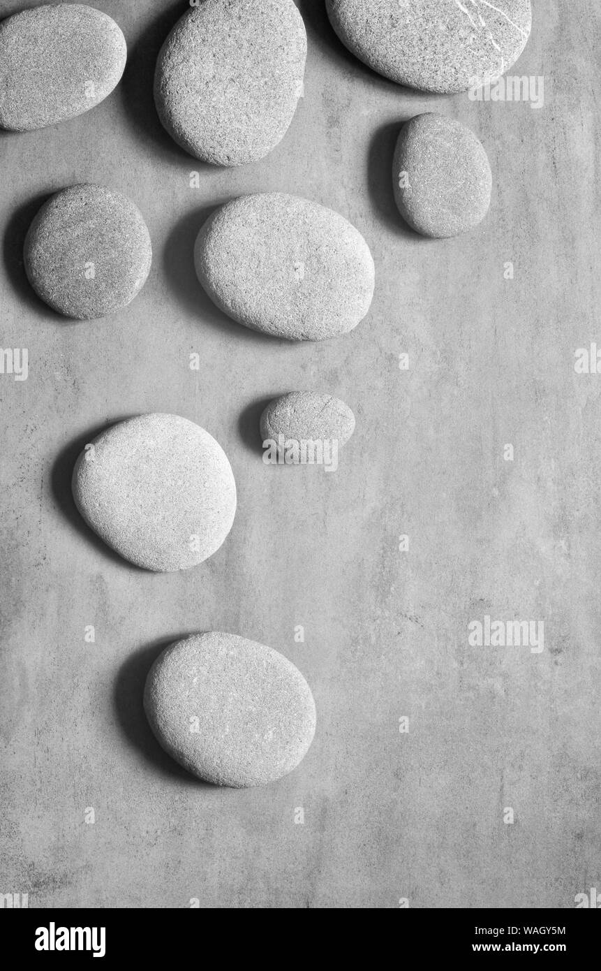 Flat lay composition with grey spa stones on grey background Stock ...