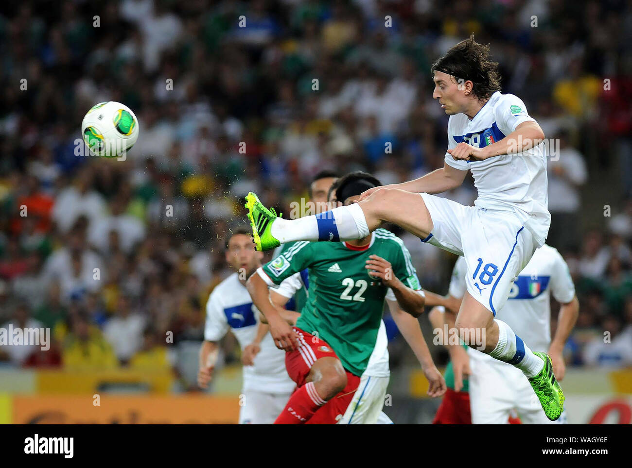 Rio de Janeiro, Brazil, June 16, 2013. Players compete for the ball during the Mexico vs Italy match for the Confederations Cup at Maracana Stadium Stock Photo