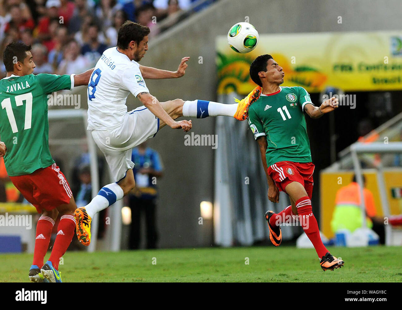 Rio de Janeiro, Brazil, June 16, 2013. Players playing the ball during the match Mexico vs Italy for the Confederations Cup at Maracana Stadium Stock Photo