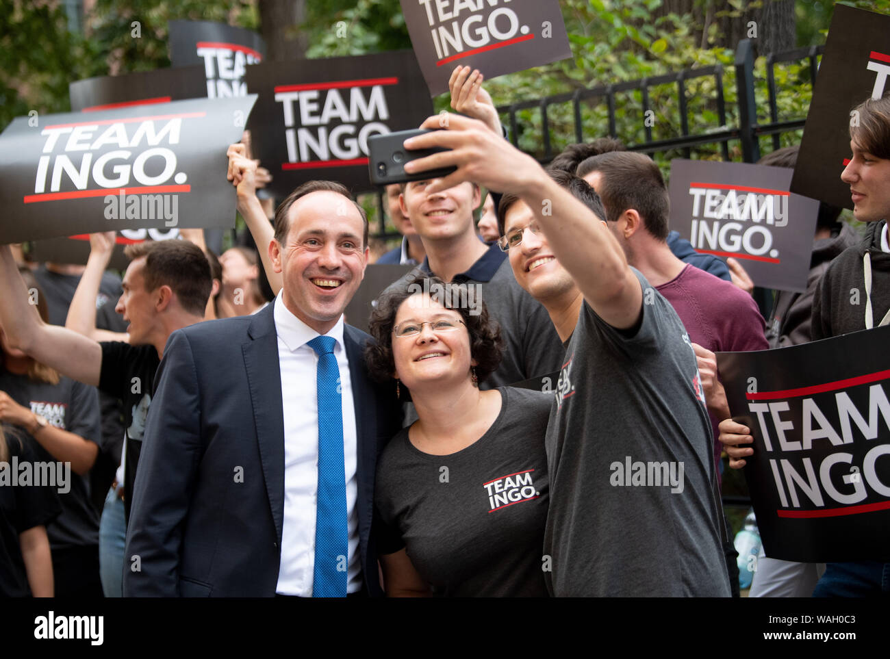 Potsdam, Germany. 20th Aug, 2019. Top candidate for the Brandenburg state election Ingo Senftleben (CDU, front left), comes to the live broadcast "Wahlarena" of the radio Berlin-Brandenburg (rbb) before the state election and takes a mobile phone photo with his supporters. Credit: Monika Skolimowska/dpa-Zentralbild/dpa/Alamy Live News Stock Photo