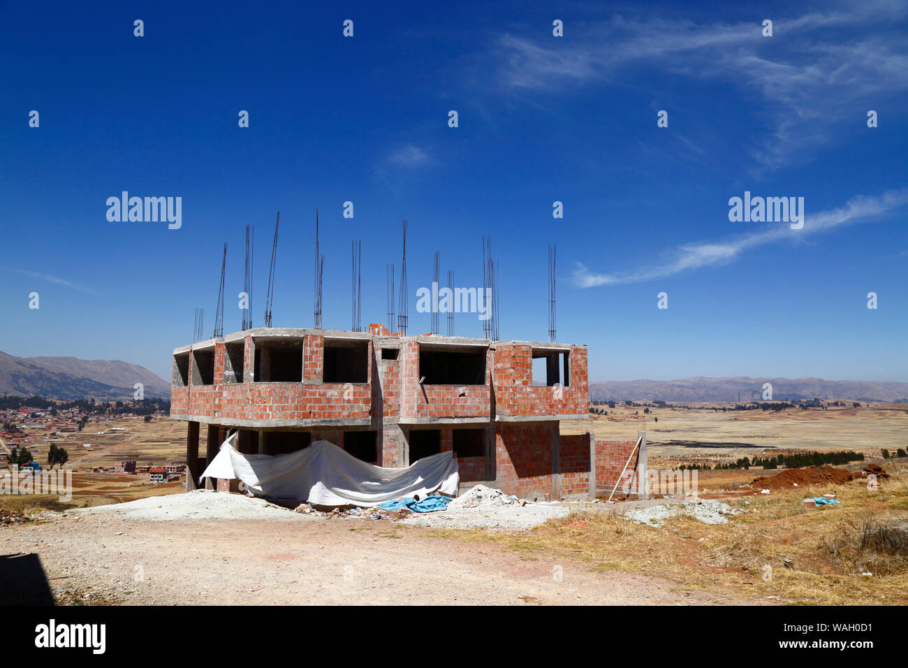 Building under construction at Nuevo Chinchero, near the original village of Chinchero, financed by compensation for land bought by the government from familiies for the construction of a new airport for Cusco and Machu Picchu, Cusco Region, Peru Stock Photo