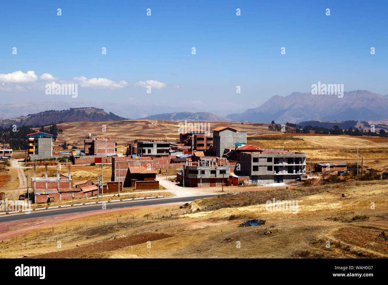 Buildings under construction at Nuevo Chinchero, near the original village of Chinchero, financed by compensation for land bought by the government from familiies for the construction of a new airport for Cusco and Machu Picchu, Cusco Region, Peru Stock Photo