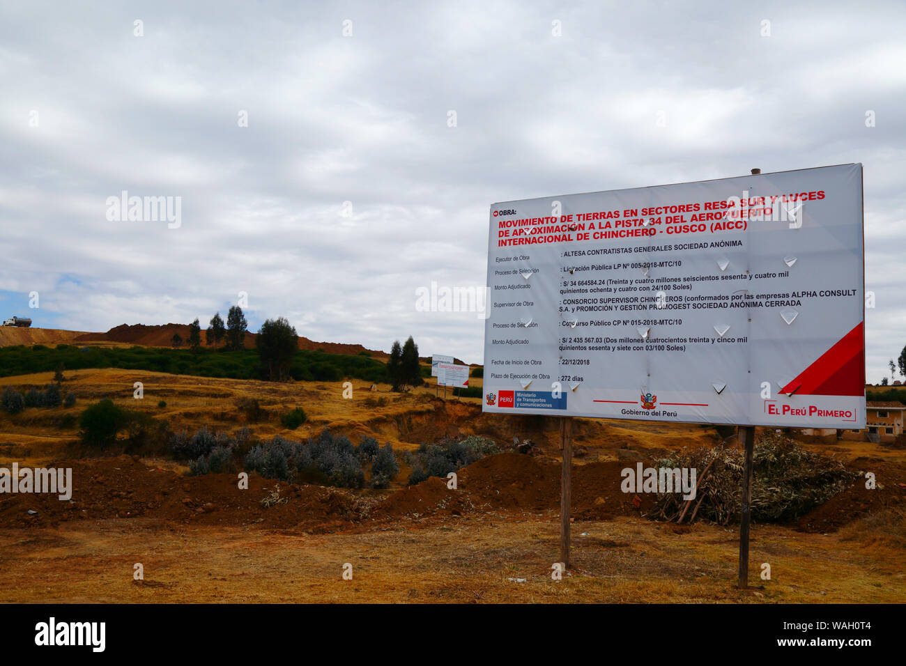 Sign announcing details of earth moving works, the start of the construction of a new international airport at Chinchero for Cusco and Machu Picchu. Cusco Region, Peru Stock Photo