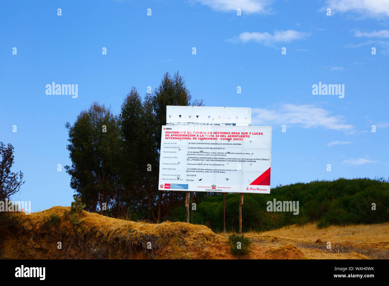 Sign announcing details of earth moving works, the start of the construction of a new international airport at Chinchero for Cusco and Machu Picchu. Cusco Region, Peru Stock Photo