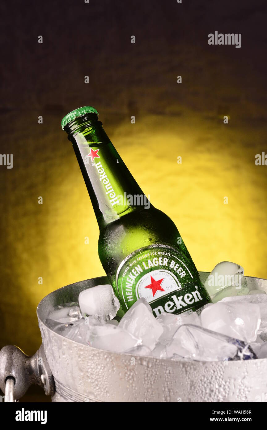 A bottle of Heineken beer chilling on the ice Stock Photo