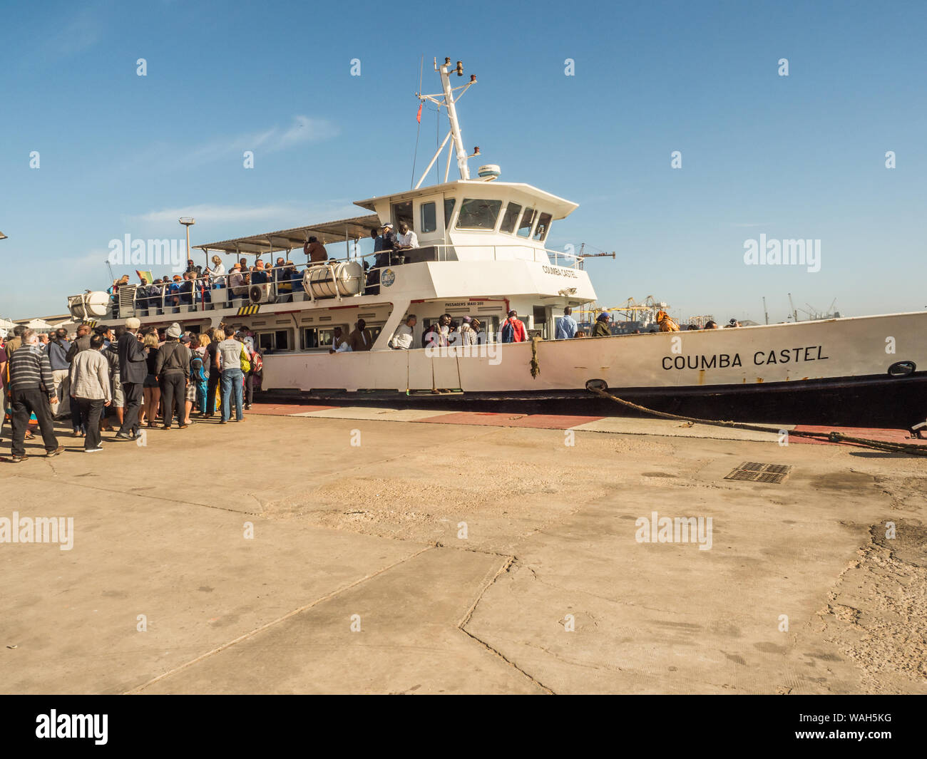 Dakar, Senegal - February 2, 2019: People waiting for the boat transporting people from Dakar to Goree island in port in Dakar. Gorée. Dakar, Senegal. Stock Photo