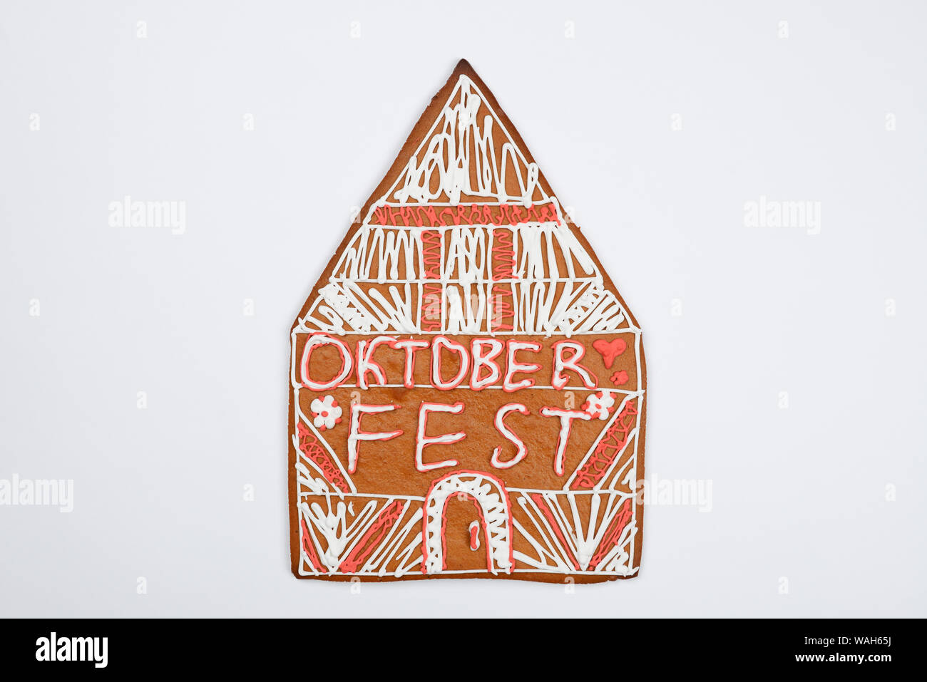 The gingerbread house with Oktoberfest inscription on white background Stock Photo