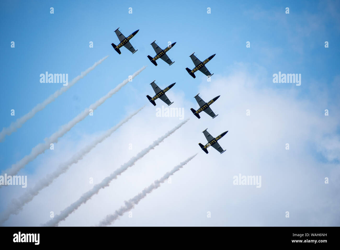 Breitling Jet Team formation flying aerobatic with smoke trails in air Stock Photo
