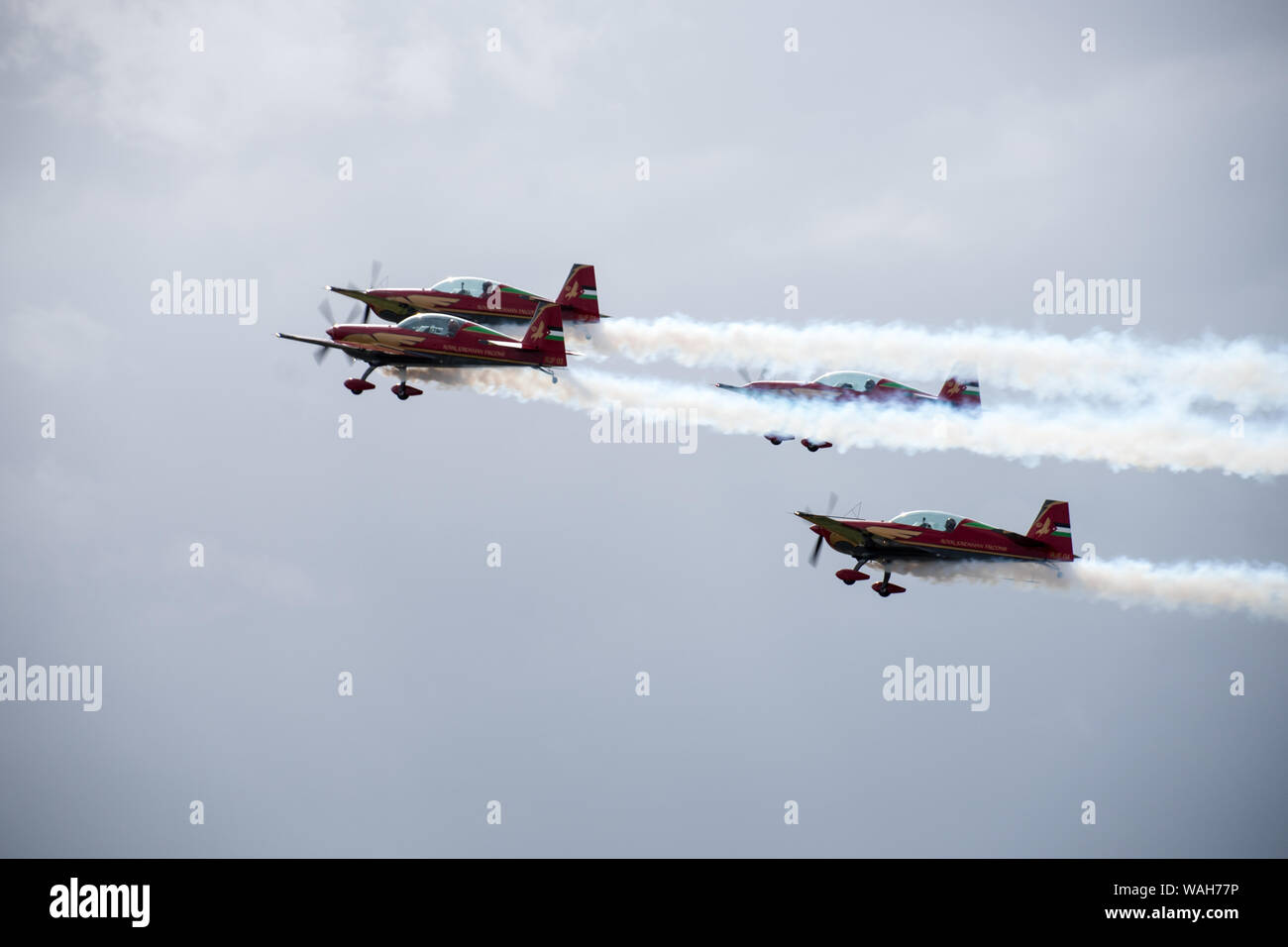 Royal Jordanian Falcons aerial display with smoke in air during formation flying Stock Photo