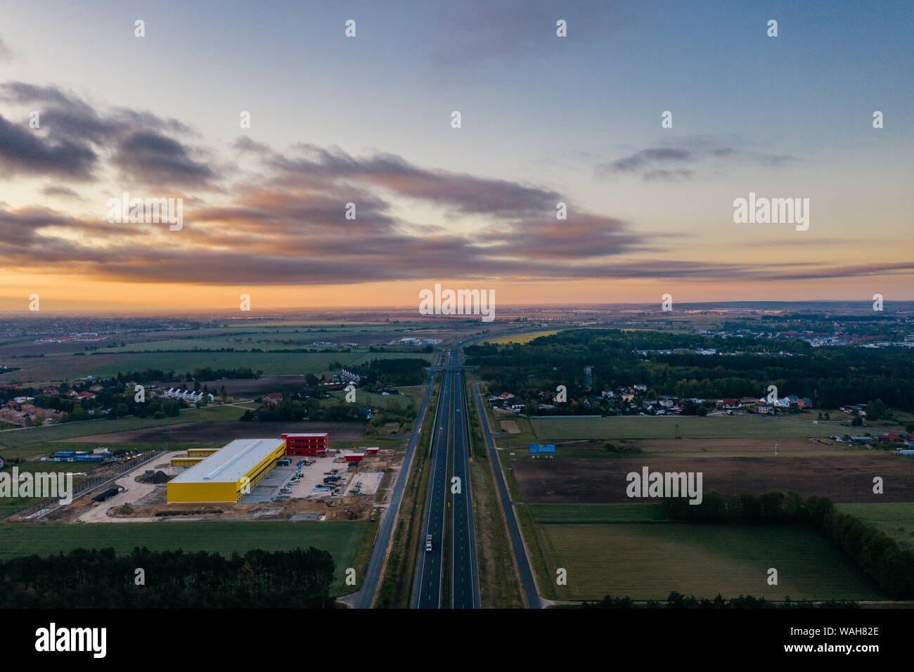 Aerial drone photography of the city suburbs, highway around the main city. Stock Photo