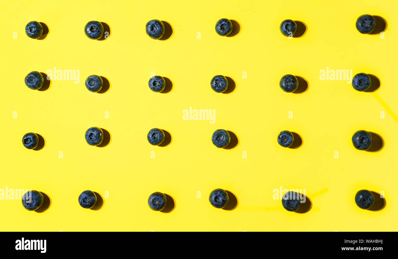 Fresh blueberry on yellow background. Stock Photo