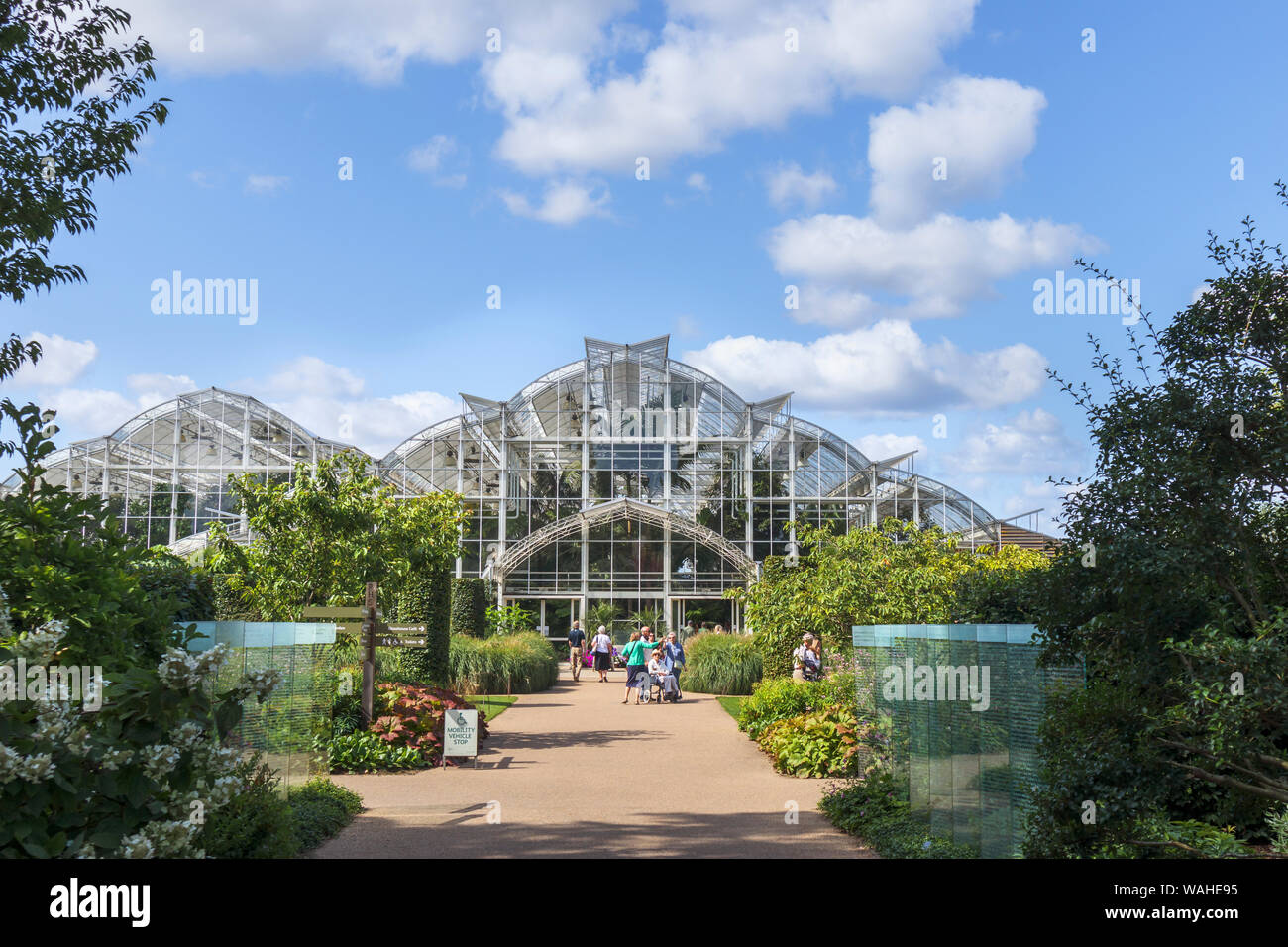View of the exterior of the iconic Glasshouse at RHS Garden, Wisley, Surrey, southeast England on a sunny day in summer Stock Photo