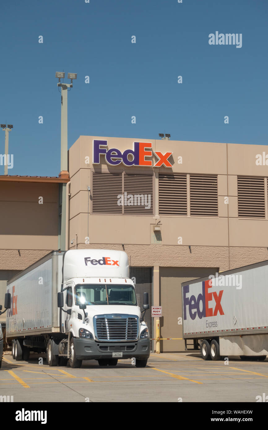 Phoenix,Az/USA - 8.16.19: Large FedEx delivery trucks at warehouse facility at SkyHarbor Airport in Phoenix.  FedEx is an American multinational couri Stock Photo