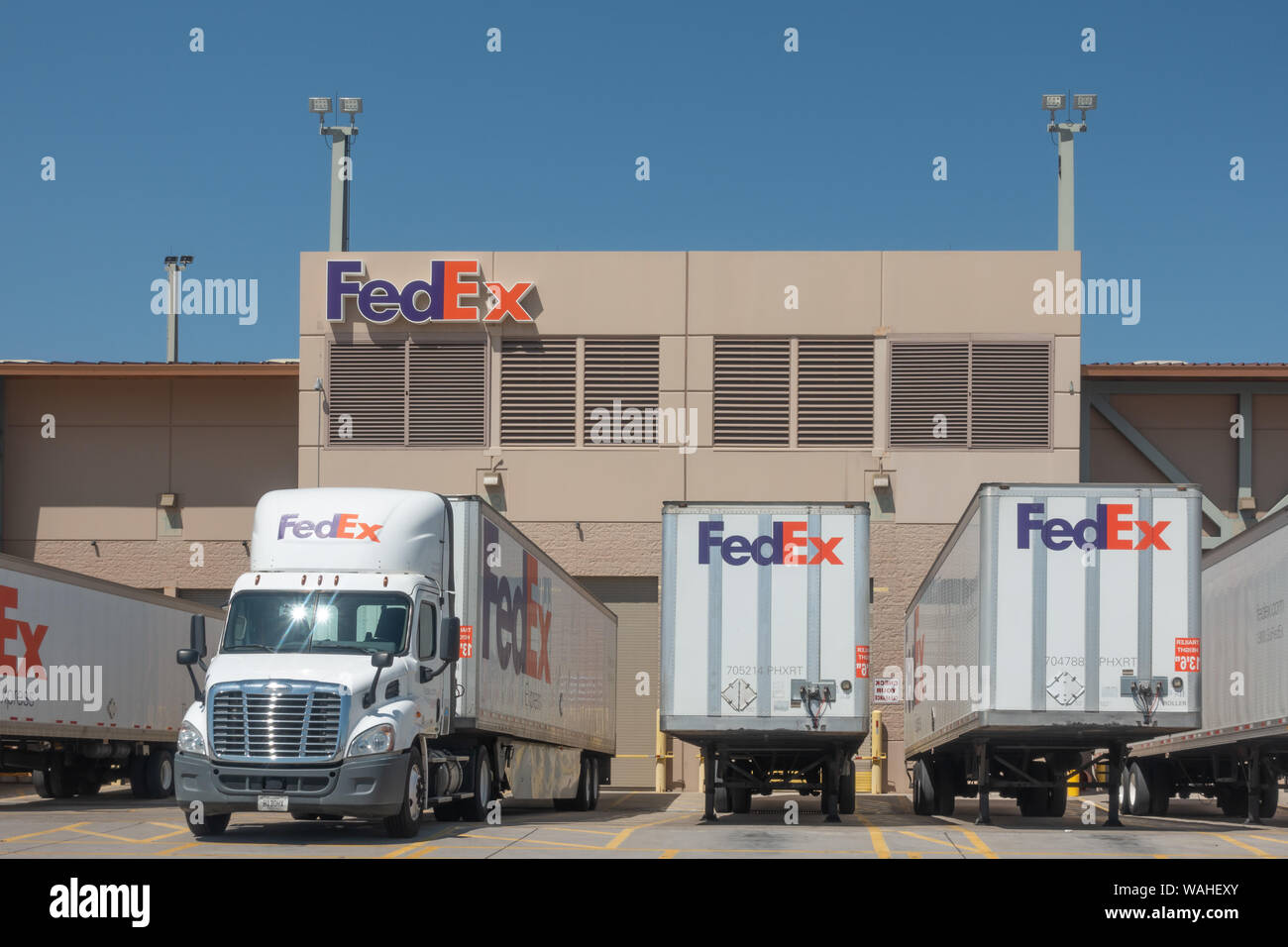 Phoenix,Az/USA - 8.16.19: Large FedEx delivery trucks at warehouse facility at SkyHarbor Airport in Phoenix.  FedEx is an American multinational couri Stock Photo