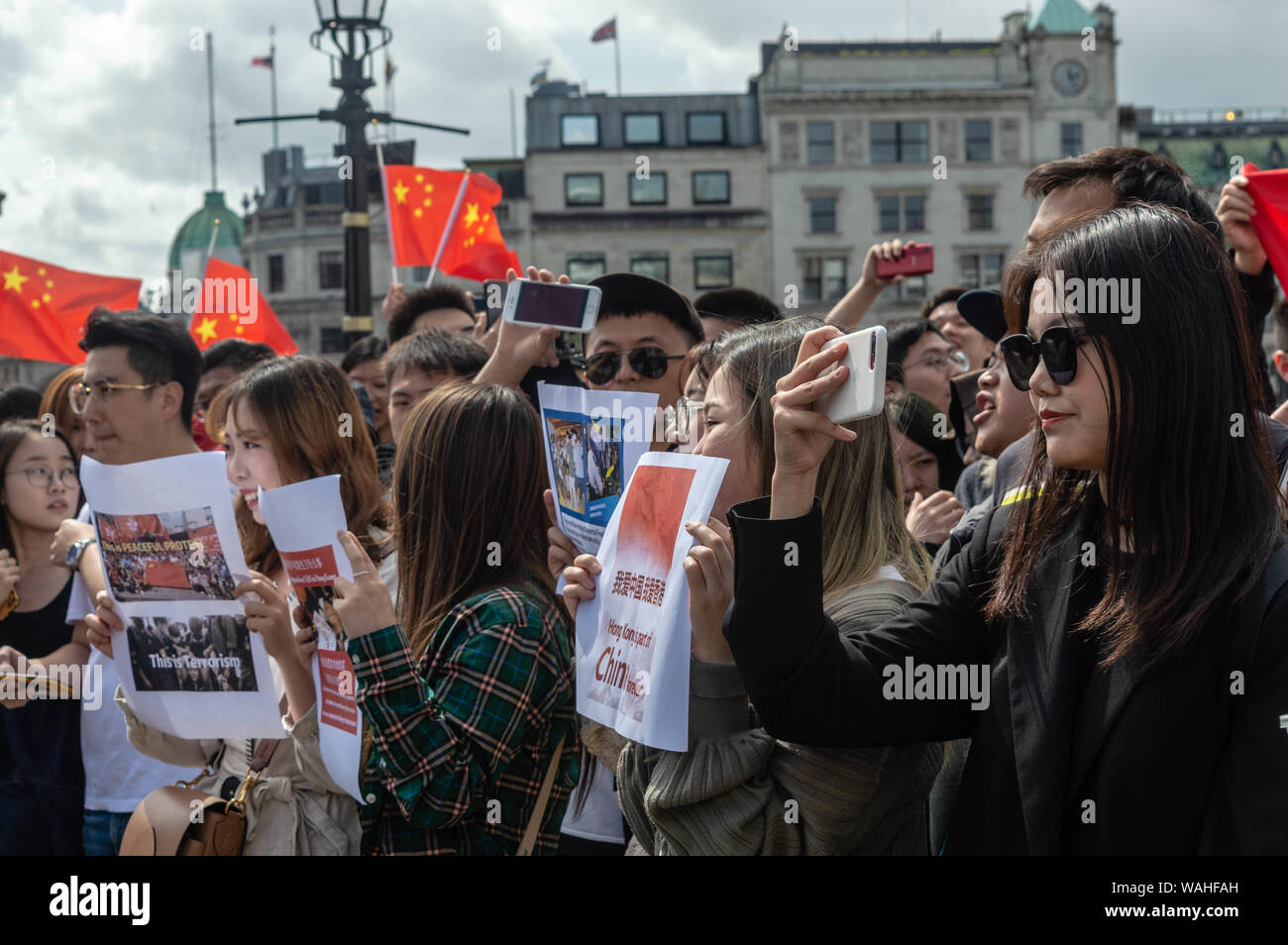 Opponents of the protesters at the UK Solidarity with Hong Kong rally holding posters. Stock Photo