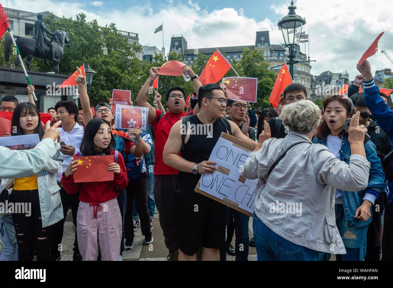 Female British national squaring up against Chinese female national at the UK Solidarity with Hong Kong rally. Stock Photo