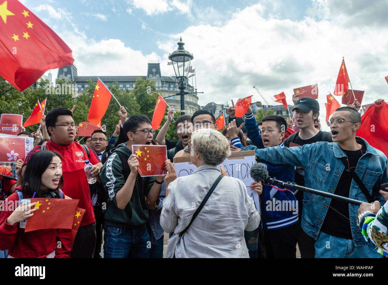 London, United Kingdom - August 17,  2019: Female British national going against opponents of the UK Solidarity with Hong Kong rally. Stock Photo