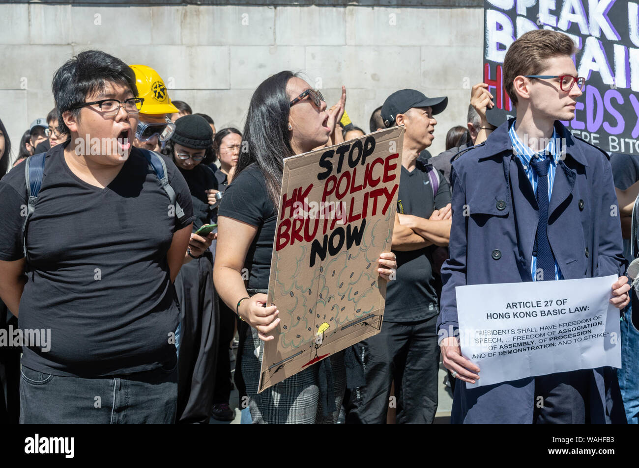 London, United Kingdom - August 17,  2019: Supporters of the UK Solidarity with Hong Kong rally chanting against those in opposition to them, Stock Photo