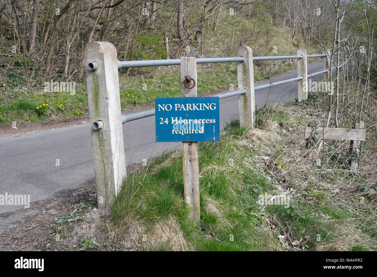 No parking sign, narrow road, Monsal Dale, Derbyshire England Stock Photo