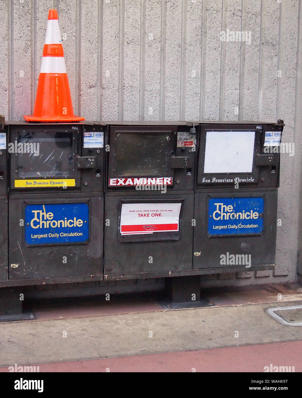 San Francisco Chronicle and Examiner newspaper boxes at train station in San Francisco, California Stock Photo