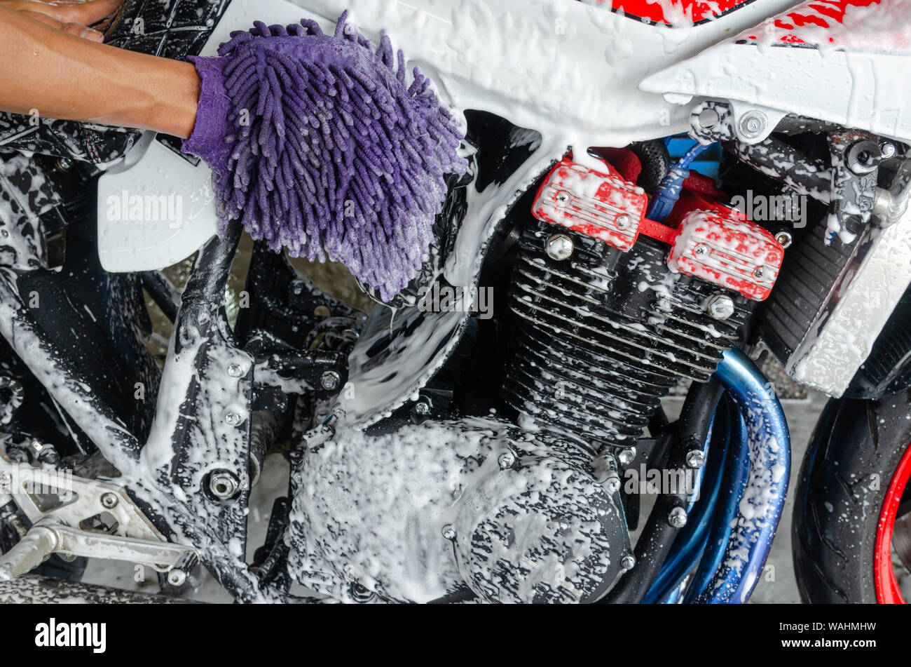 Bubble foam cleaning motorcycle wash Stock Photo Alamy