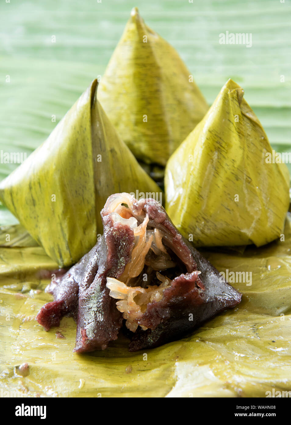 Thai dessert, made of rice flour and coconut with sugar ,Banana leaf wrap (cooked Stock Photo