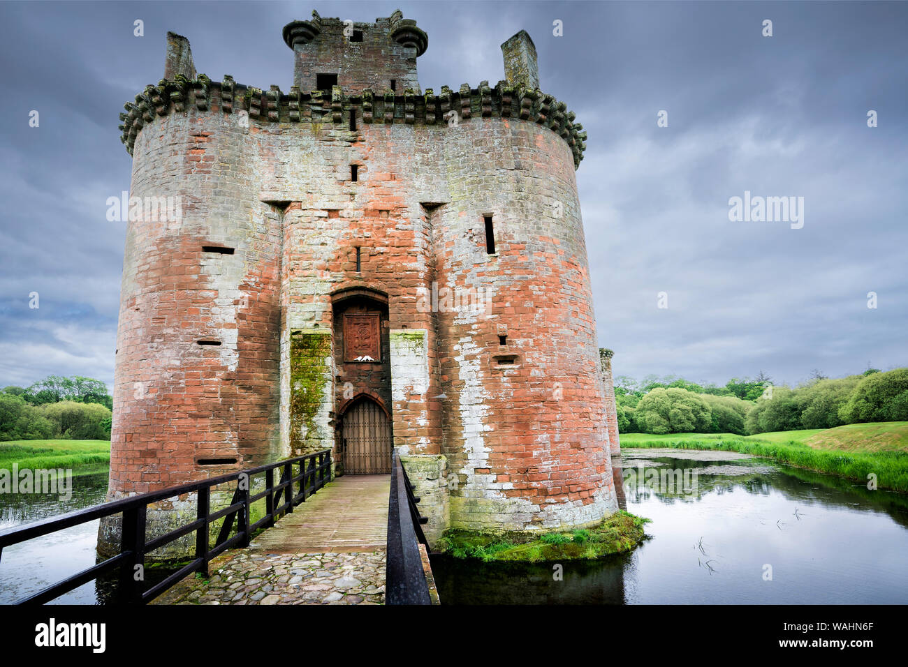 Caerlaverock Castle front view of the moated triangular fortified castle built in the 13th century in southern Scotland, and abandoned in the 17th c Stock Photo