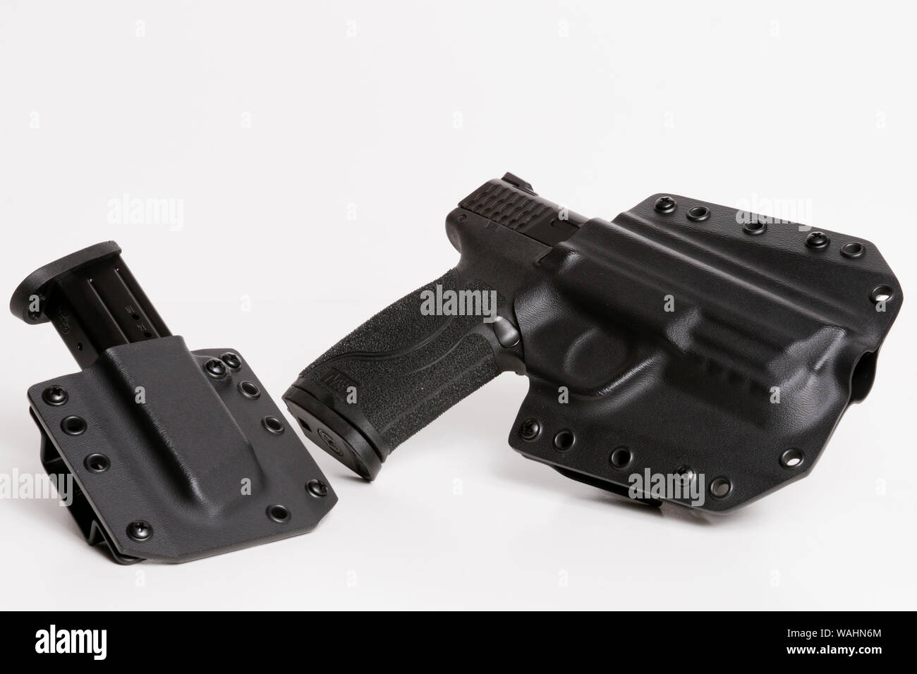 Smith and Wesson 9mm in Bravo Concealment Holster with Extra Magazine Stock Photo
