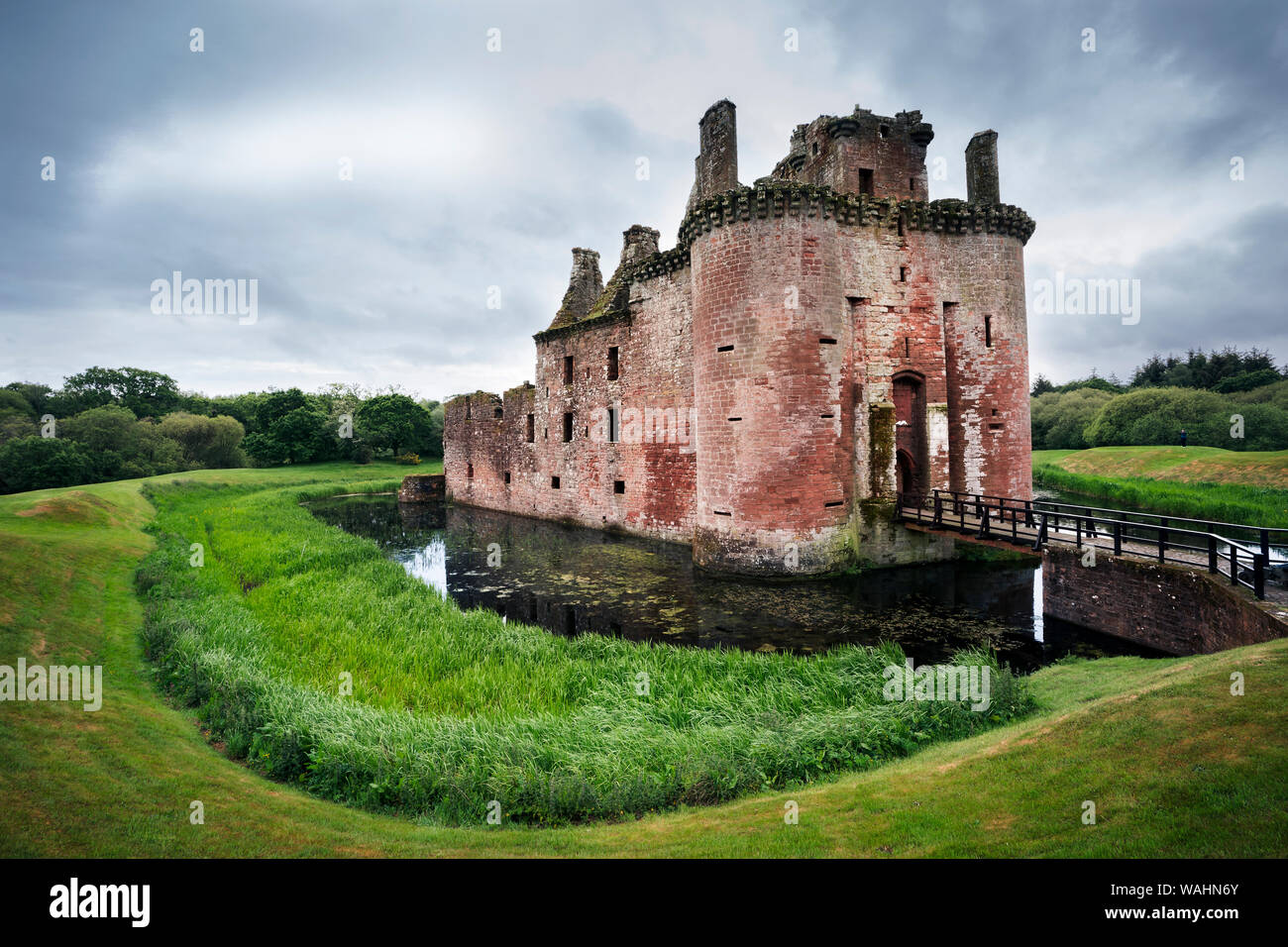 Front view of moated triangular Caerlaverock Castle in Scotland, Dumfries, UK Stock Photo