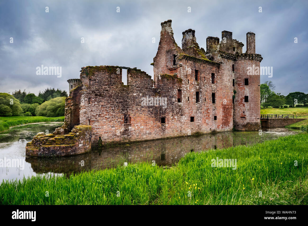 Caerlaverock Castle, side view of the moated triangular fortified castle built in the 13th century in southern Scotland, and abandoned in the 17th cen Stock Photo