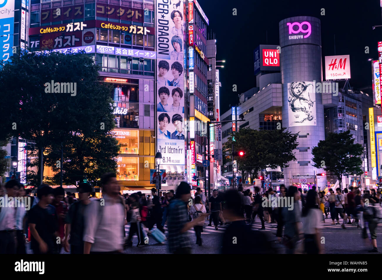 TOKYO, JAPAN - August 20, 2019 : Shibuya Scramble Crossing at night. Motion blur. Selective Focus. Stock Photo