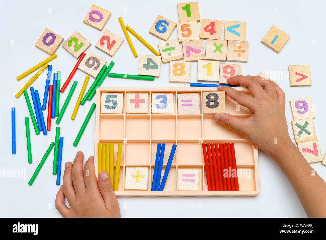 kid doing addition equation using counting rods Stock Photo Alamy