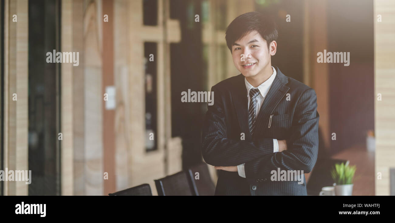 Young asian businessman smiling hi-res stock photography and images - Alamy