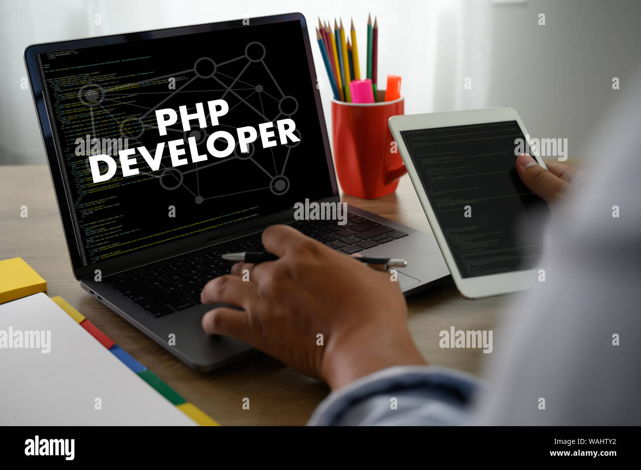 PHP DEVELOPER man touch bar search and Two Businessman working at ...