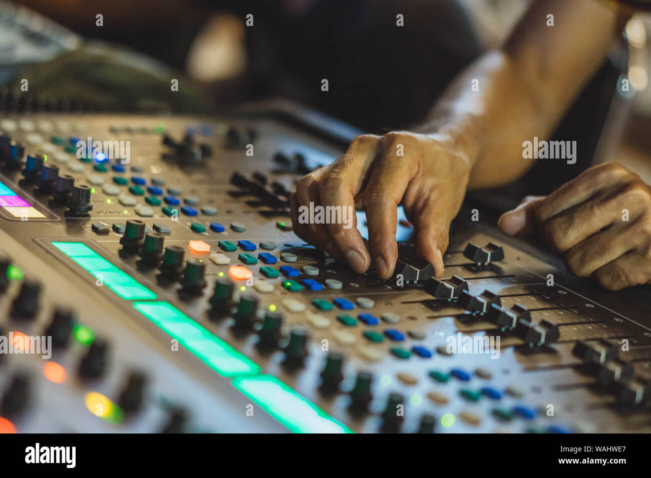 Technician hand adjust audio mixer Stock Photo Alamy
