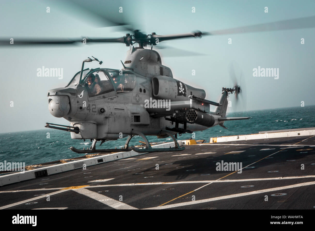 190815-M-QP663-1046 ARABIAN SEA (Aug. 15, 2019) An AH-1Z Viper attached to Marine Medium Tiltrotor Squadron (VMM) 163 (Reinforced), 11th Marine Expeditionary Unit (MEU), takes off from the flight deck of the amphibious transport dock ship USS John P. Murtha (LPD 26). The Boxer Amphibious Ready Group and 11th MEU are deployed to the U.S. 5th Fleet area of operations in support of naval operations to ensure maritime stability and security in the Central Region, connecting the Mediterranean and the Pacific through the Western Indian Ocean and three strategic choke points. (U.S. Marine Corps photo Stock Photo