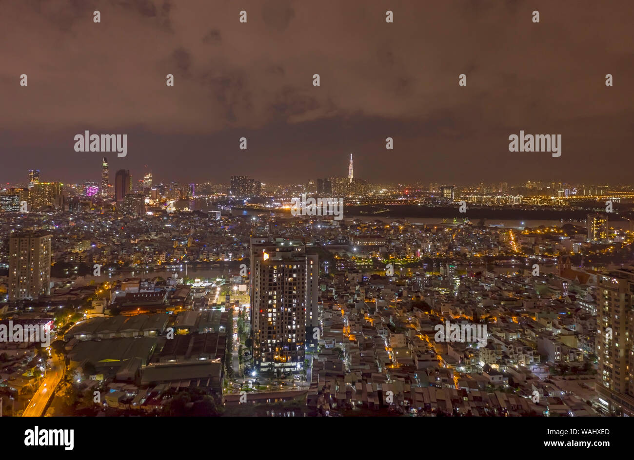 Epic And Spectacular Wide Angle Drone Shot Of Ho Chi Minh City Illuminated By City Lights At Night View Is From District 7 And Shows The Saigon River Stock Photo Alamy