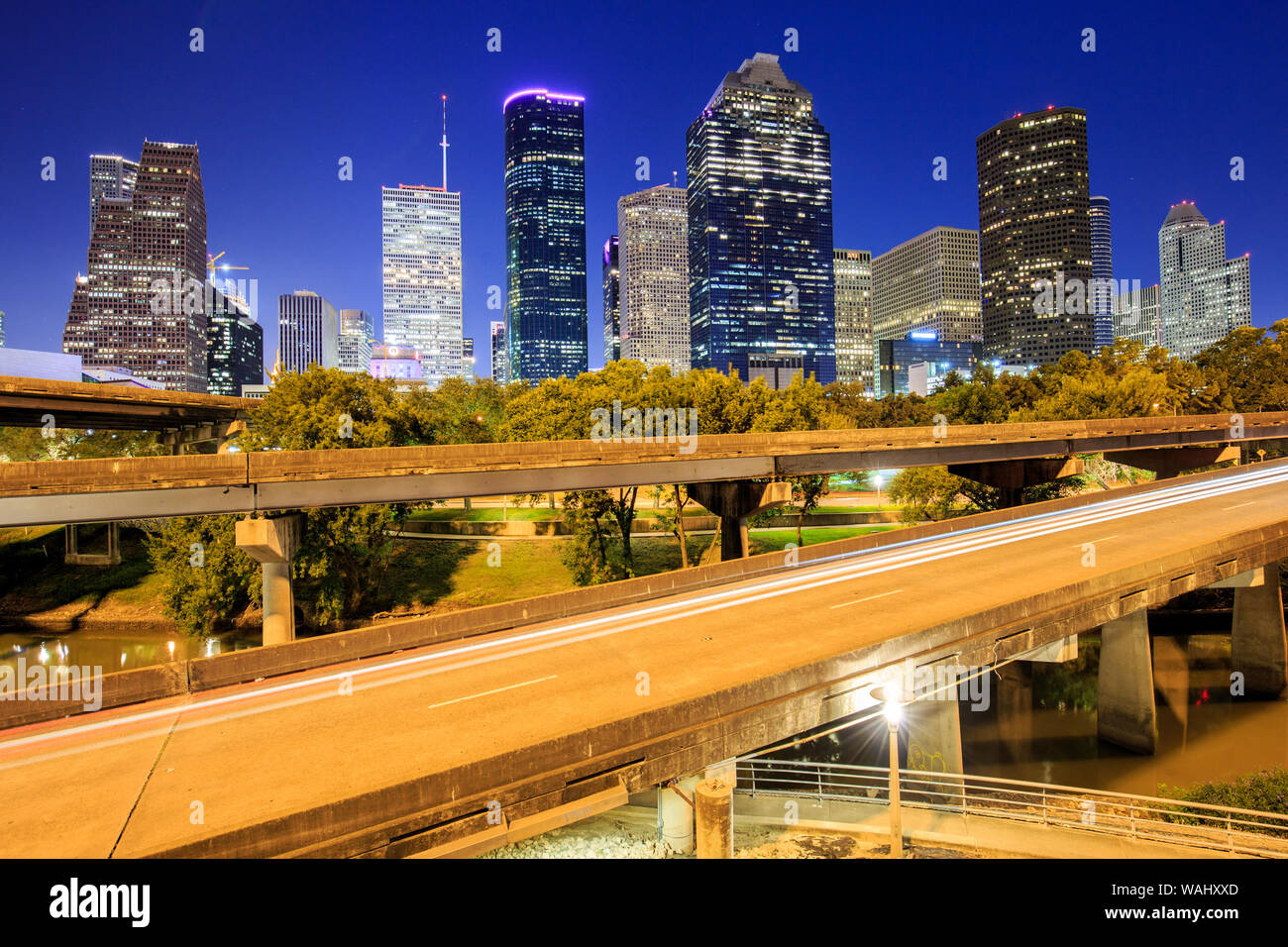 https://c8.alamy.com/comp/WAHXXD/view-of-downtown-houston-city-texas-in-a-beautiful-day-at-night-WAHXXD.jpg