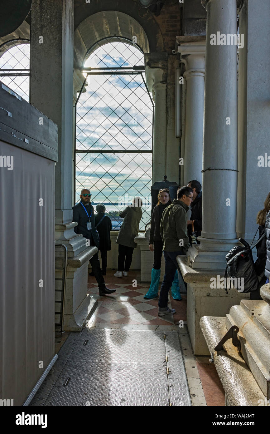 Visitors in the belfry of the Campanile di San Marco (bell tower), Saint Mark's Square, Venice, Italy Stock Photo