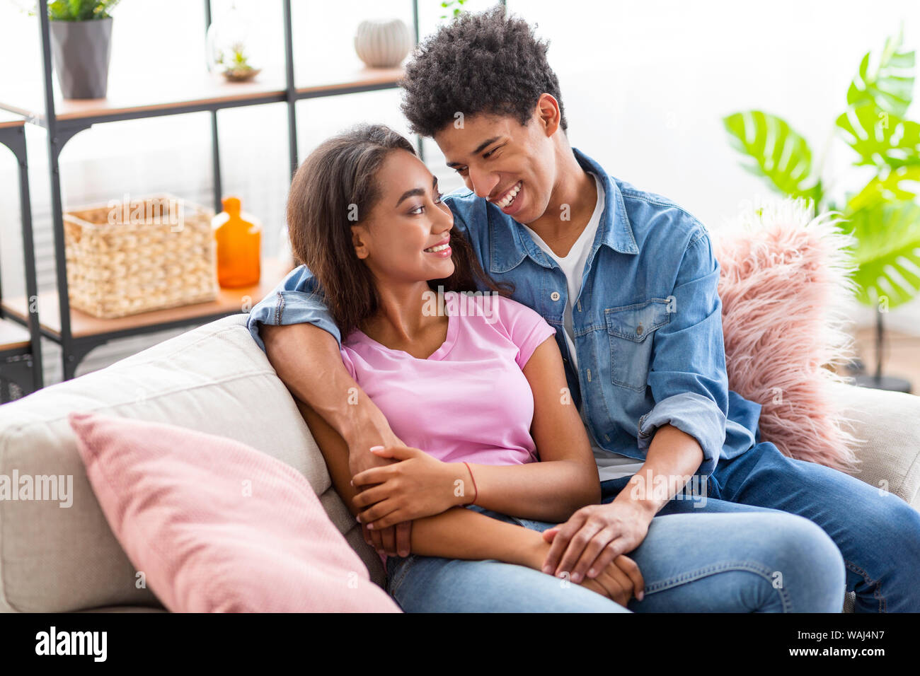 couple cuddling on couch