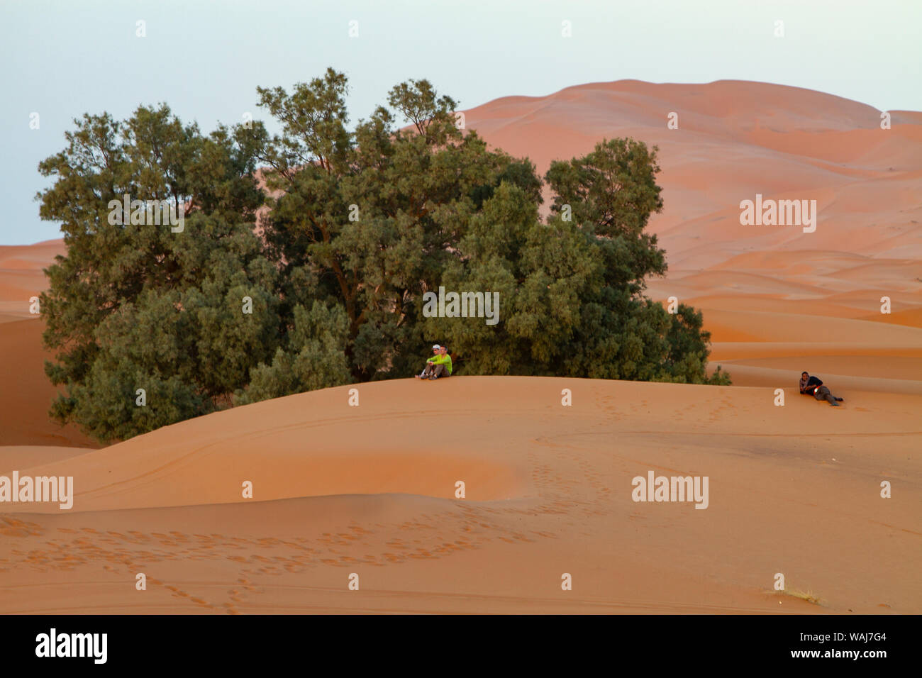 Merzouga, Erg Chebbi, Sahara Desert. Sitting on the sand dunes Stock Photo