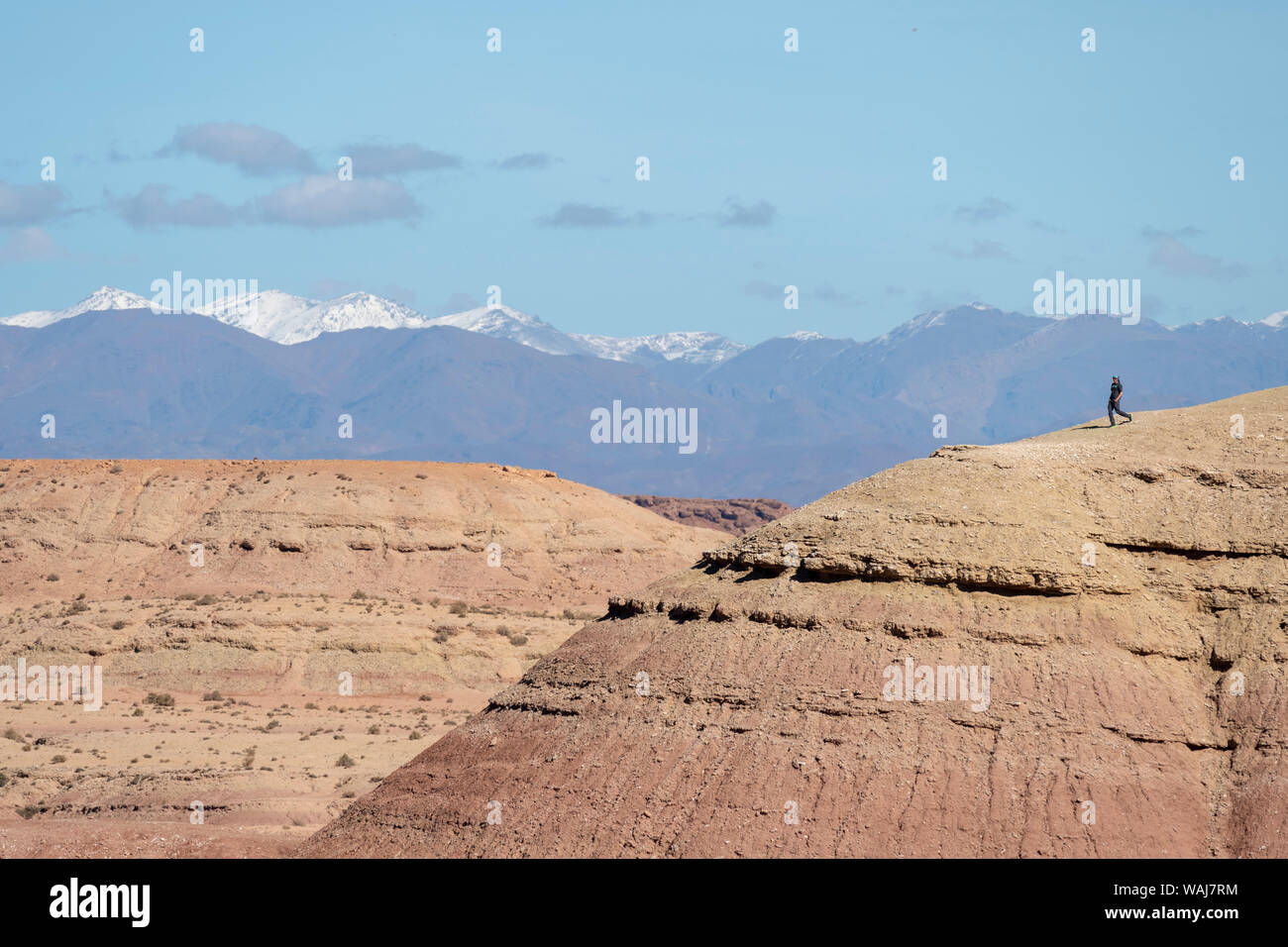 Africa, Morocco, Ait Benhaddou. Person atop barren hill. Credit as: Bill Young / Jaynes Gallery / DanitaDelimont.com Stock Photo