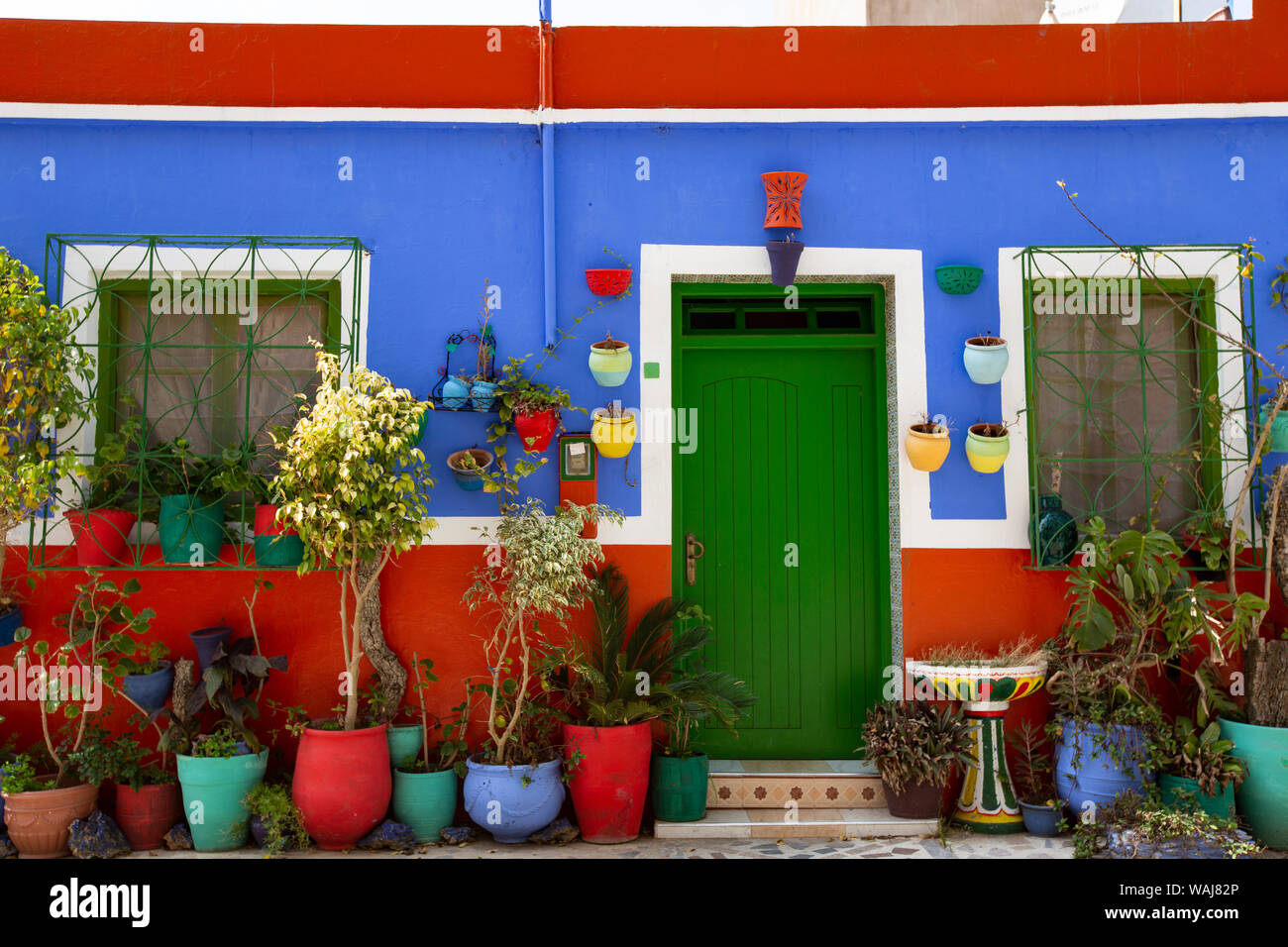 Asilah, Morocco. Multicolored house with potted plants Stock Photo Alamy