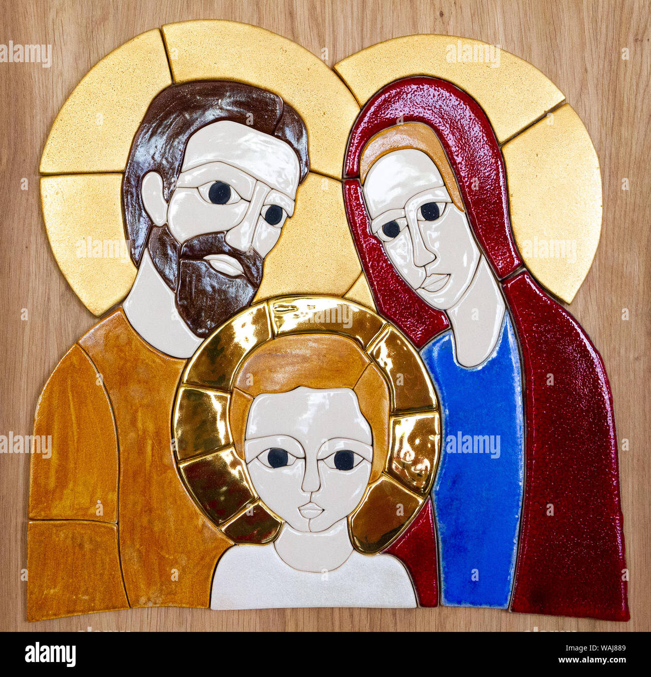 A glazed-tile mosaic of the Holy Family - Jesus, Mary and Joseph by Lubo Michalko. Displayed in the Quo Vadis Catholic House. Stock Photo