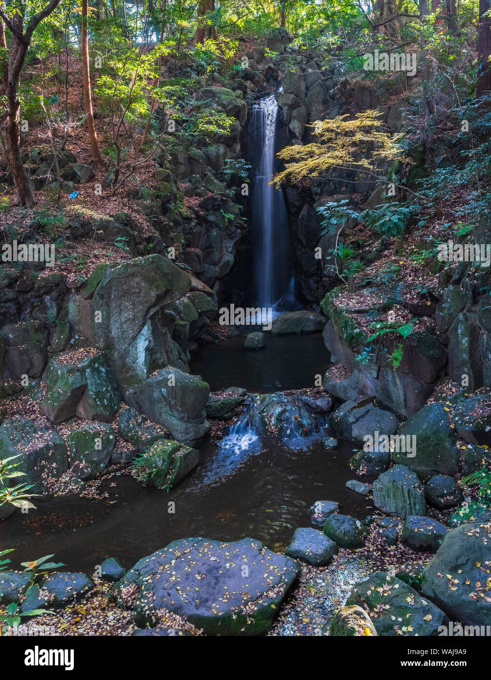 Waterfall in Autumn colors in the Narita Temple Garden Stock Photo