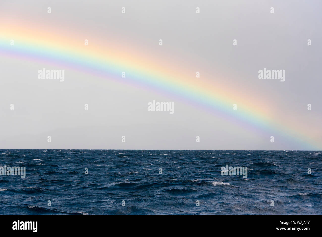 Australia, Tasmania, Maria Island. Rainbow in Tasman Sea Stock Photo